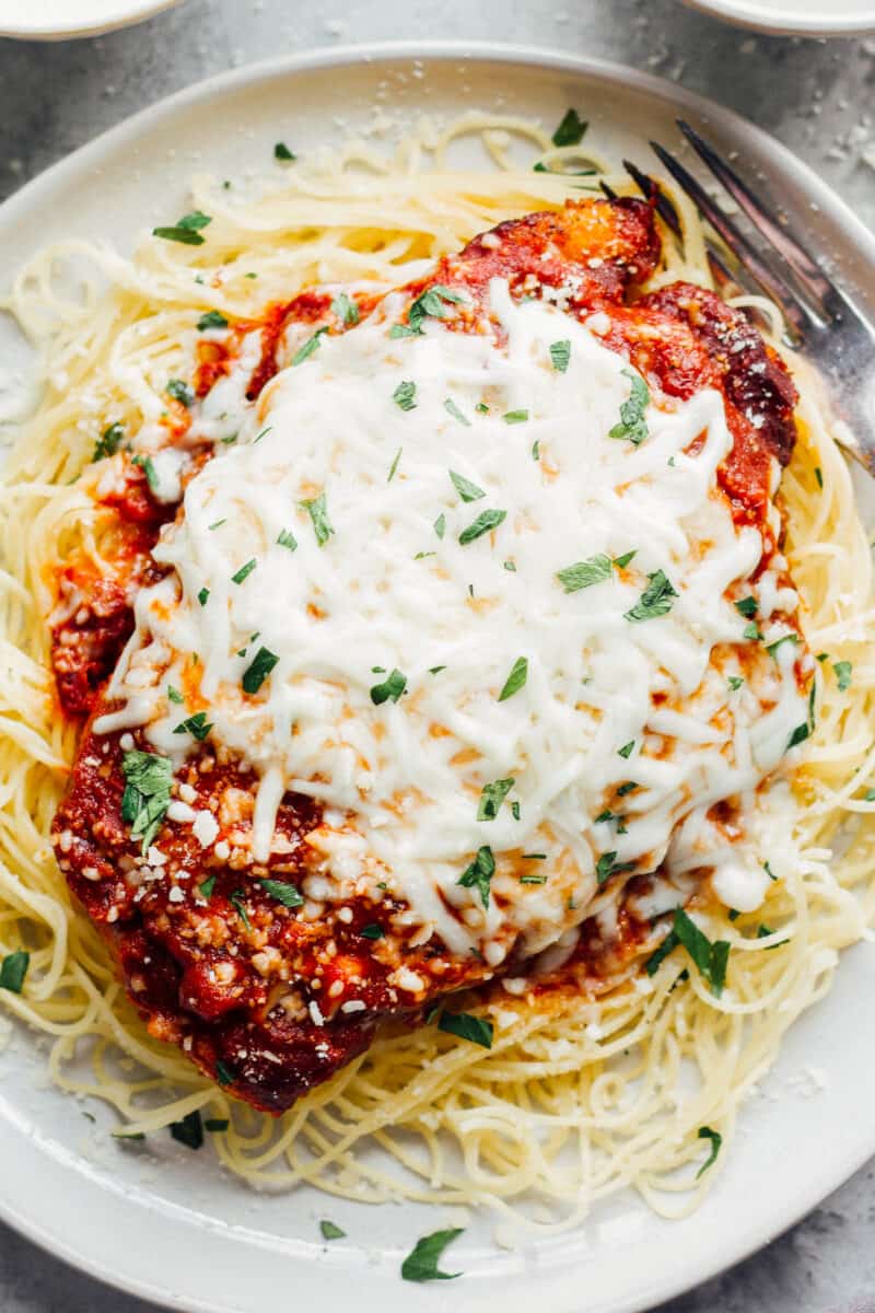 cheesy chicken parmesan on spaghetti