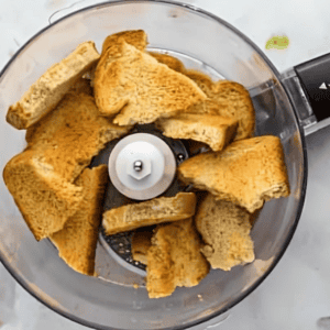 pieces of toast in a food processor.