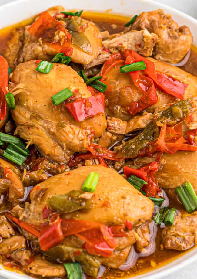 up close image of adobo chicken thighs on platter