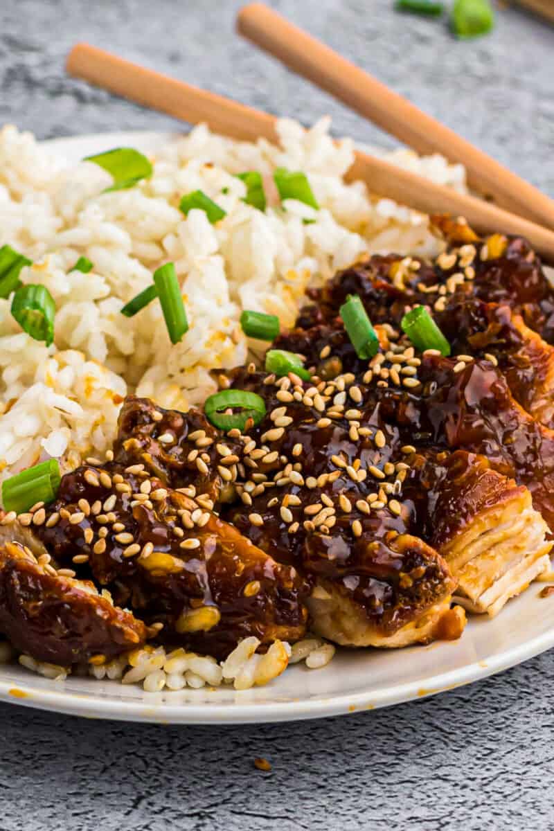 instant pot chicken teriyaki with rice on plate garnished with green onion