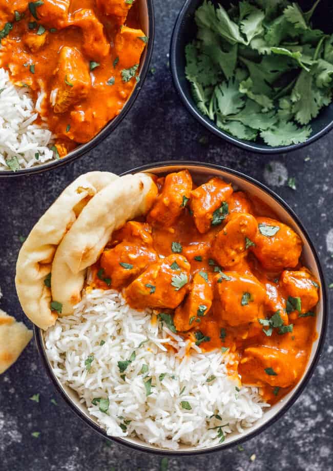 one bowl of chicken tikka masala with naan