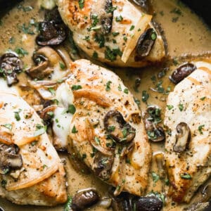 skillet with sauce and marsala stuffed chicken