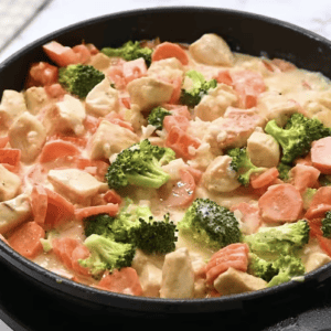 A skillet is filled with creamy primavera
