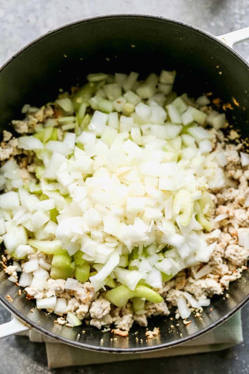 ground chicken and onions in pot