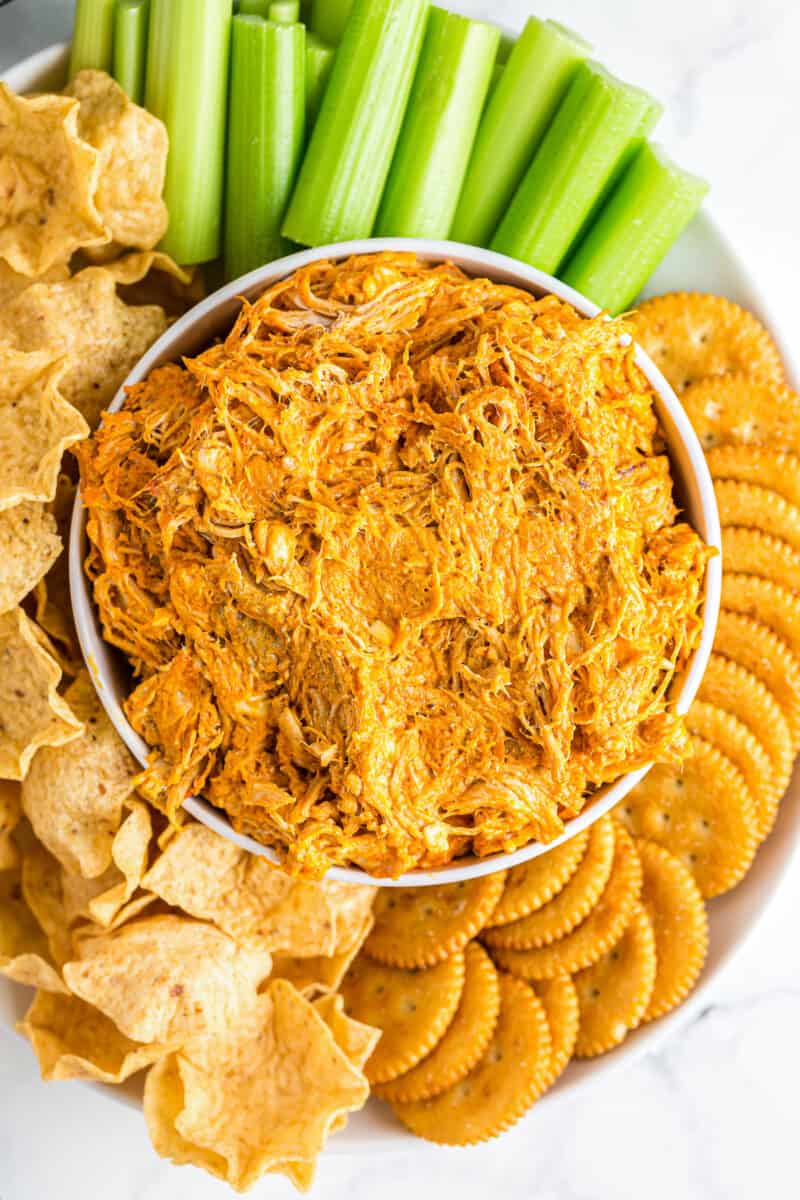 bowl of buffalo chicken dip with chips and crackers