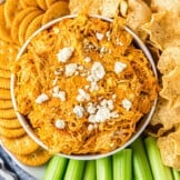 bowl of buffalo chicken dip with chips and crackers