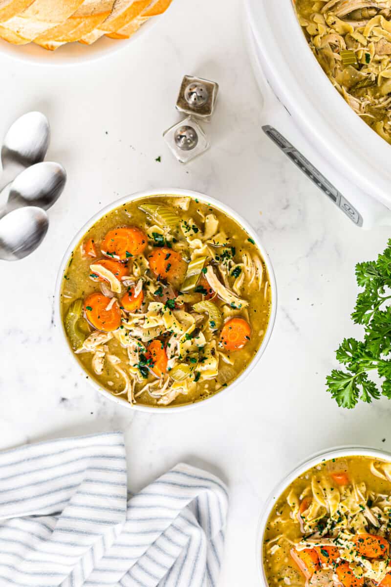 white bowl of slow cooker chicken noodle soup