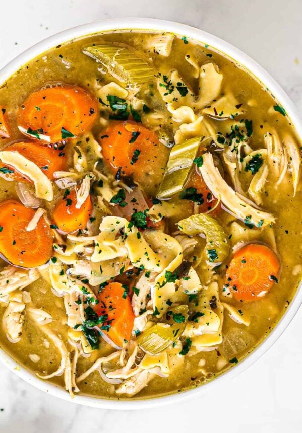 white bowl of crockpot chicken noodle soup