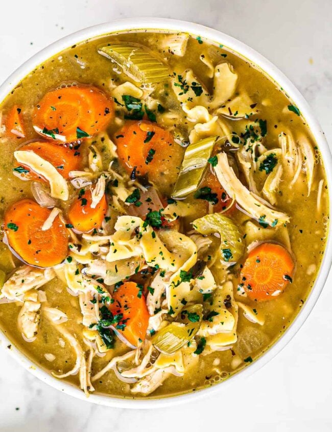 white bowl of crockpot chicken noodle soup