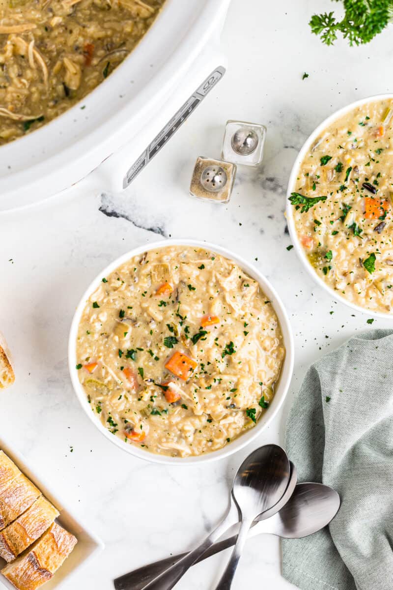 bowls of crockpot chicken and wild rice soup