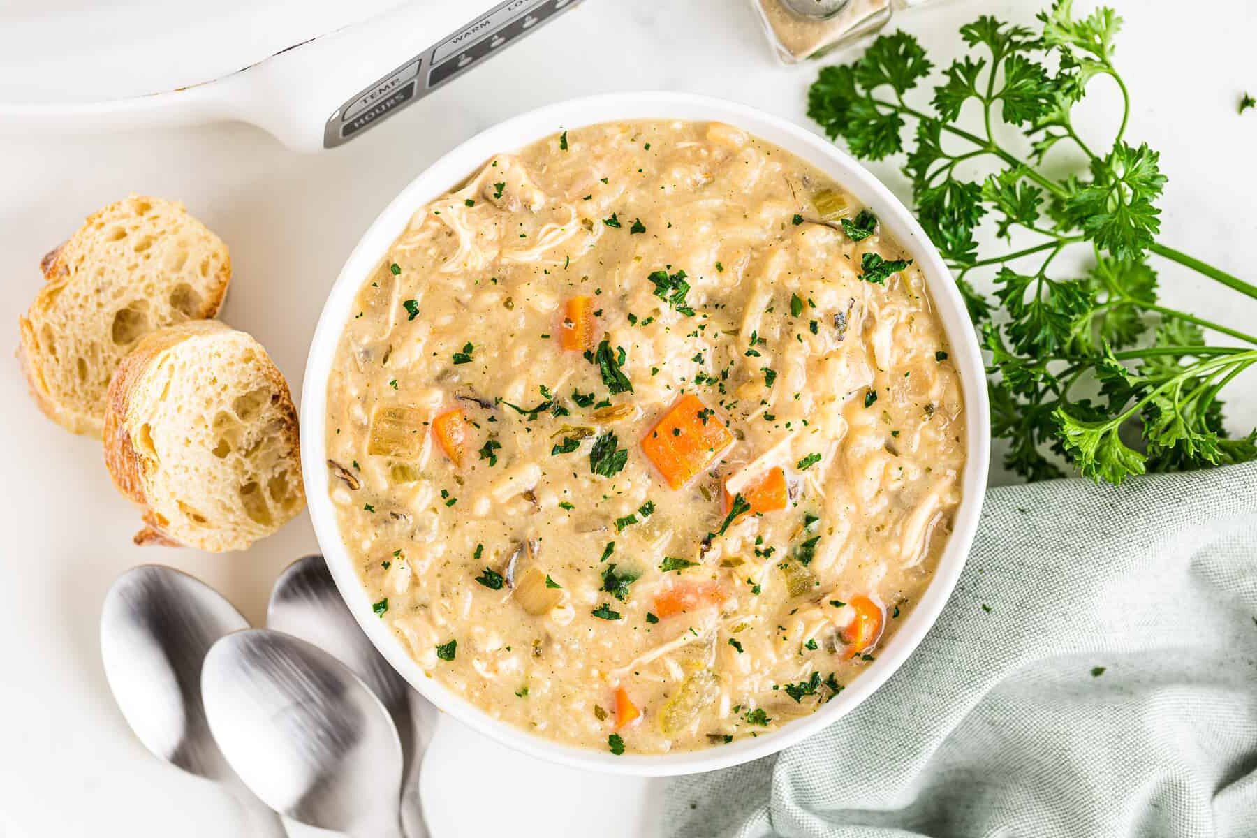 white bowl with creamy chicken wild rice soup.