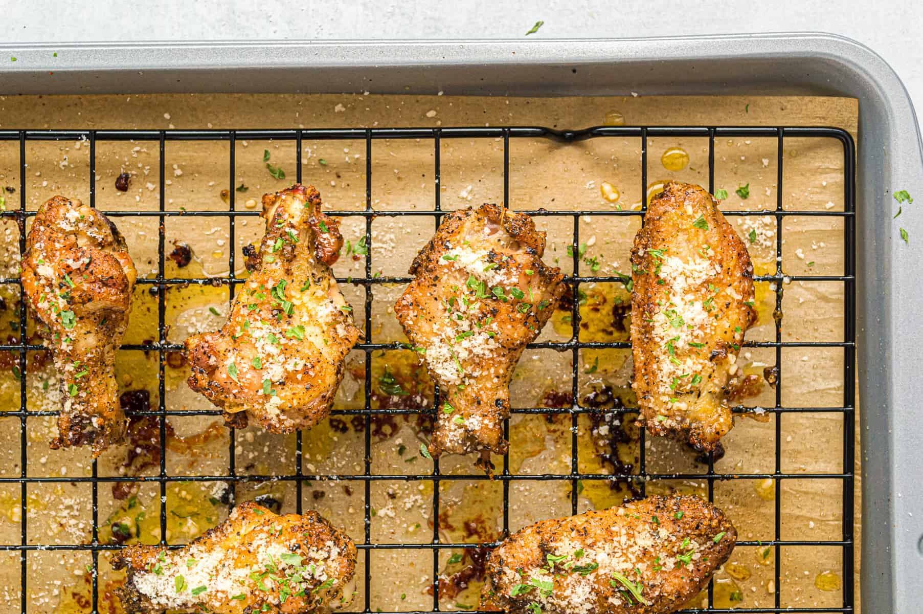 garlic parmesan wings on baking sheet