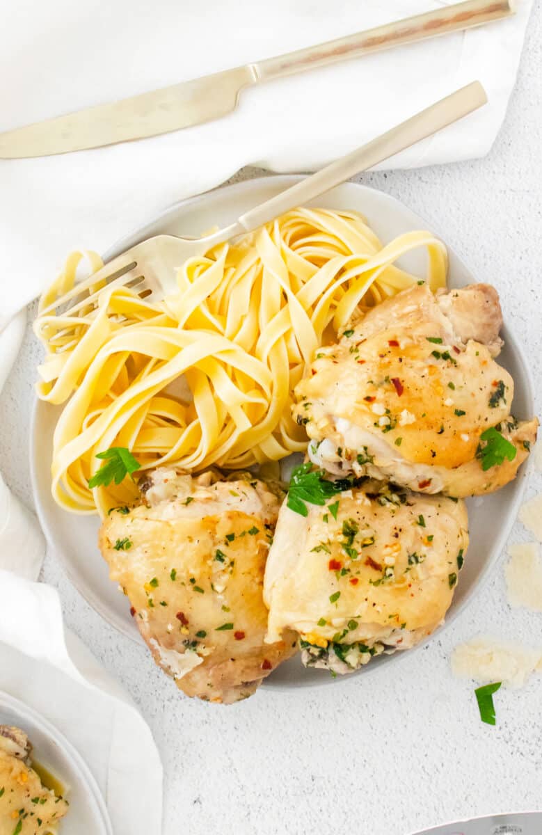 instant pot garlic parm chicken thighs on white plate
