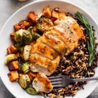 sliced maple dijon chicken with rice and vegetables