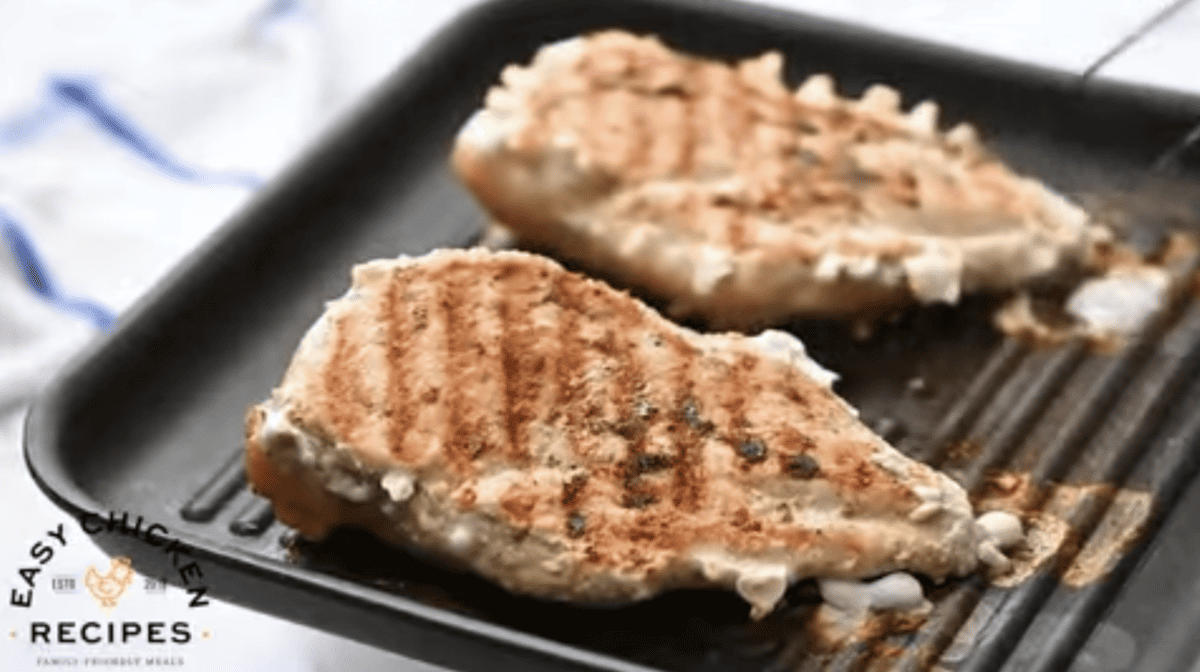 Chicken breasts are being grilled. 