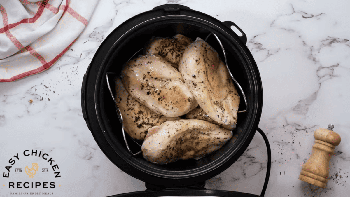 Chicken breasts are placed in the Instant Pot. 