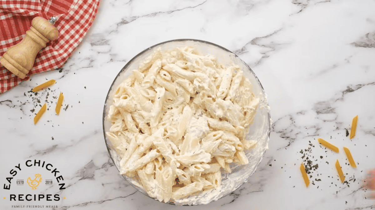 A bowl is filled with chicken bacon ranch pasta.