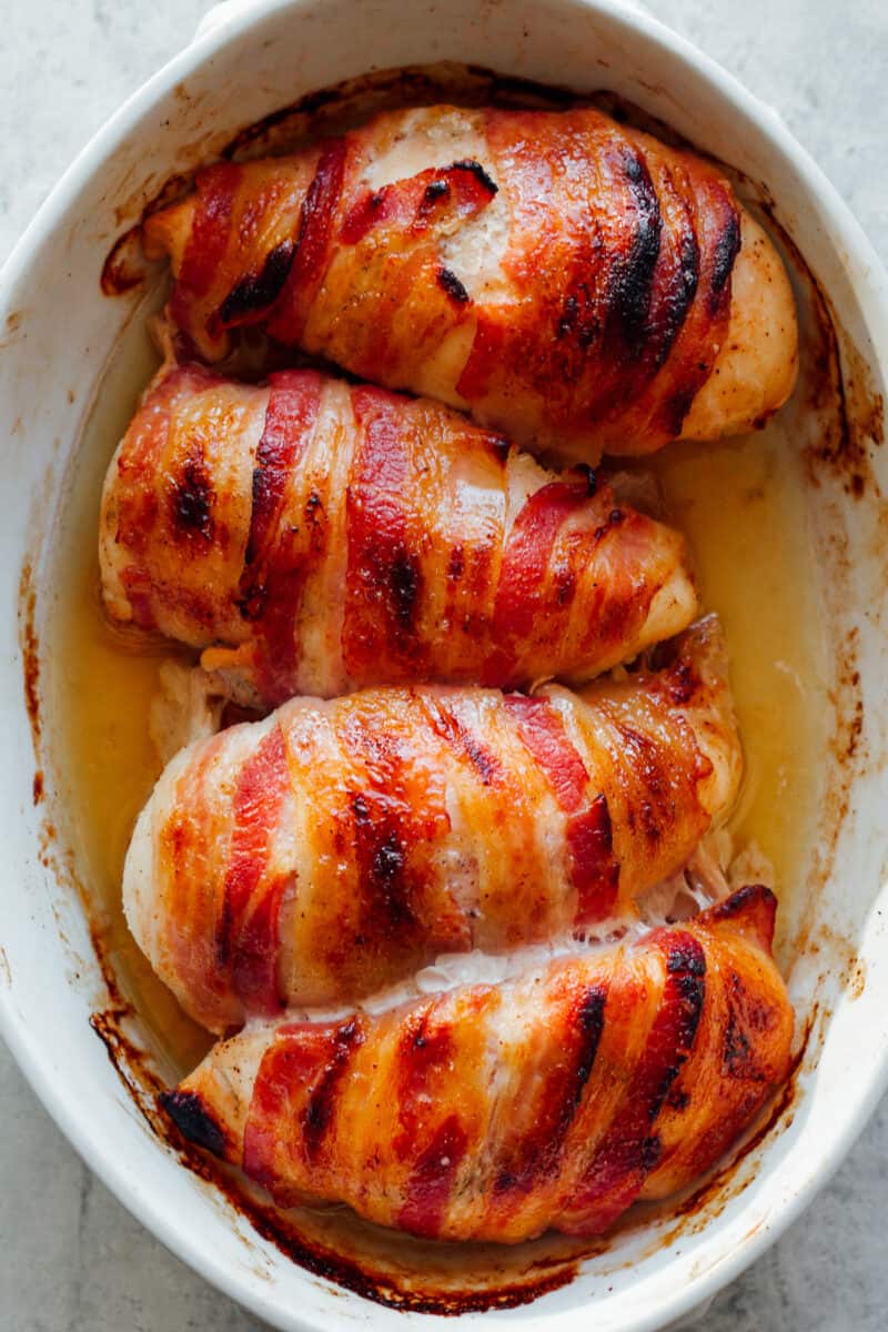 bacon wrapped chicken in baking dish