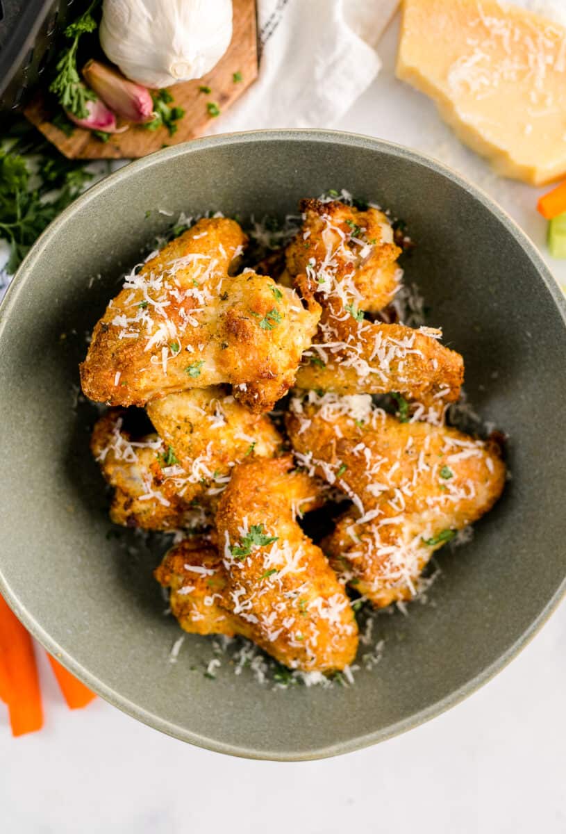green bowl with air fryer garlic parmesan chicken wings