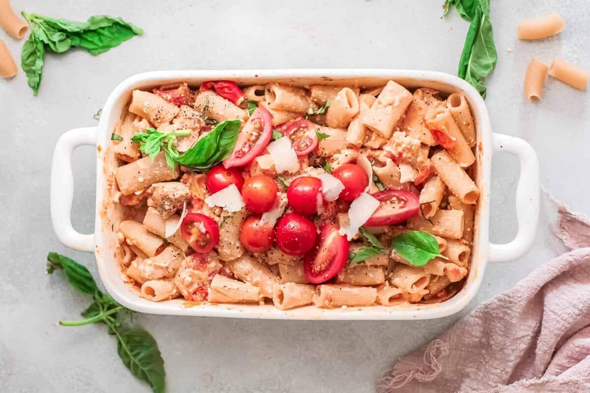 baking dish filled with chicken baked feta pasta