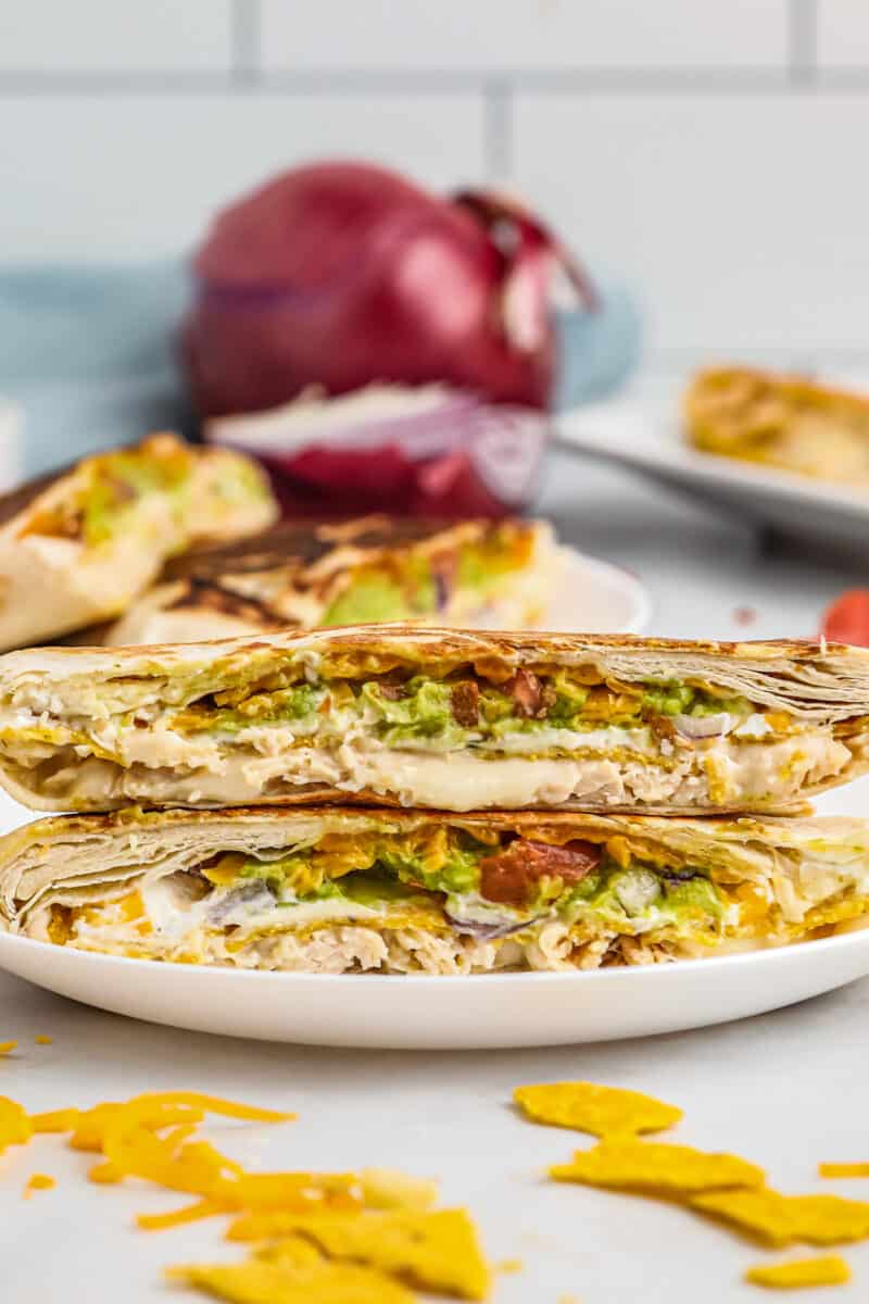 stacked chicken crunchwrap supremes on white plate