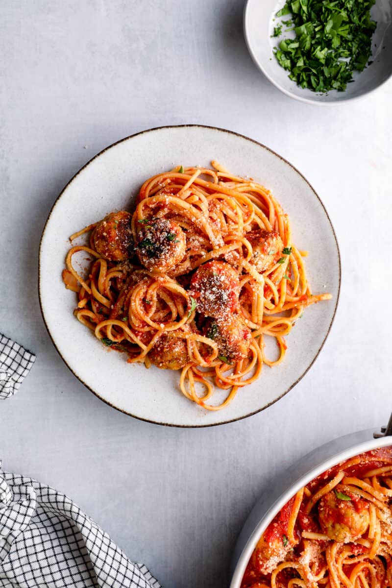 spaghetti with chicken meatballs on white plate