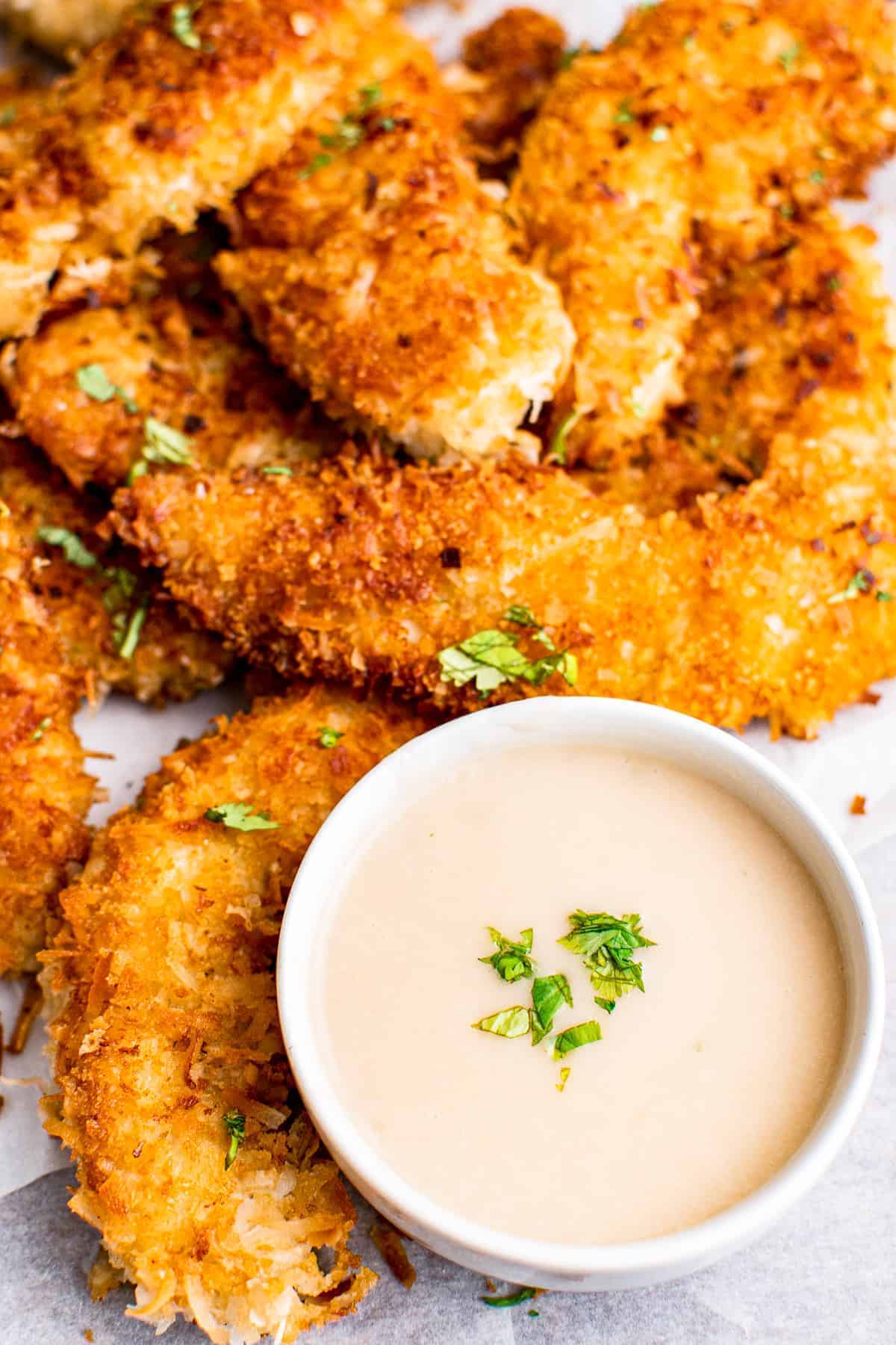 up close coconut chicken tenders with pina colada dip