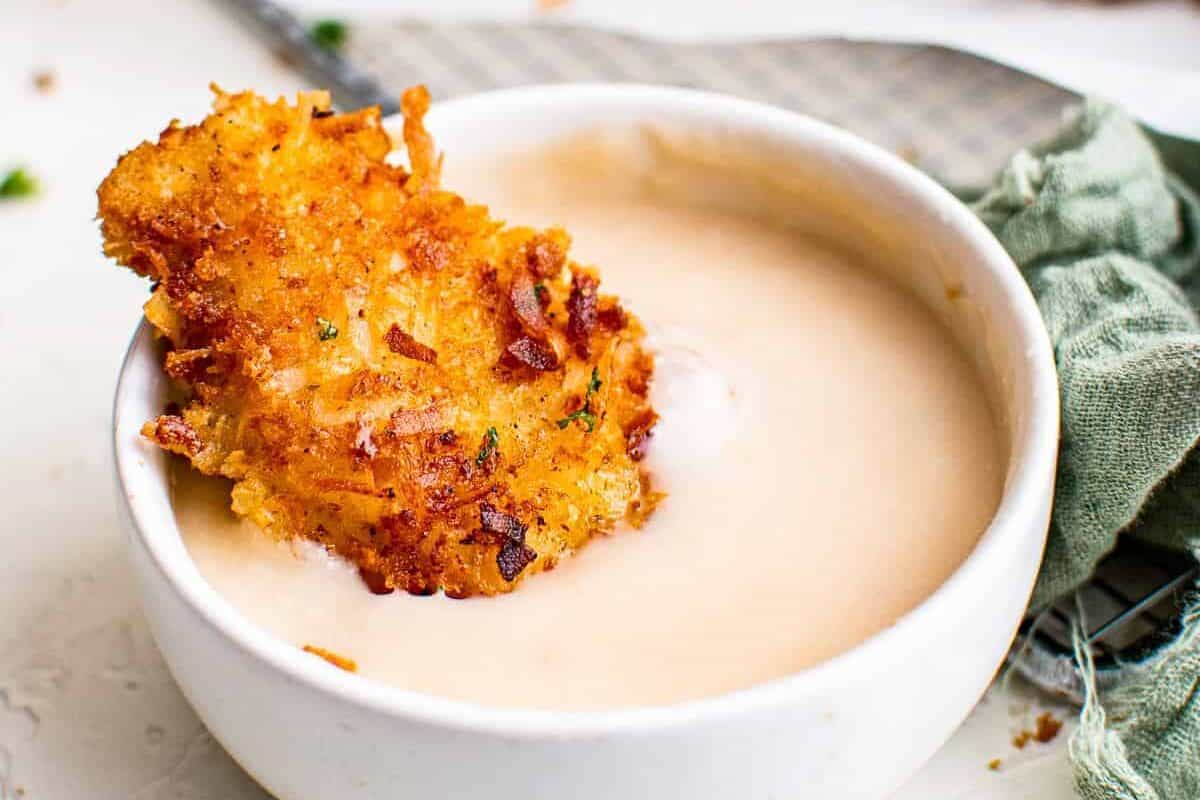 dipping coconut chicken tender in pina colada dip