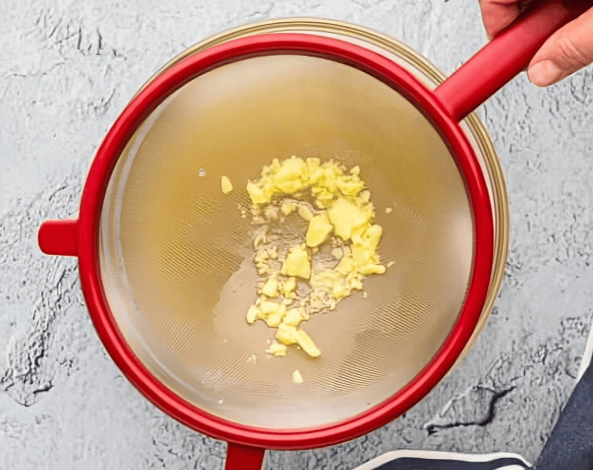 straining fat out of instant pot chicken stock.