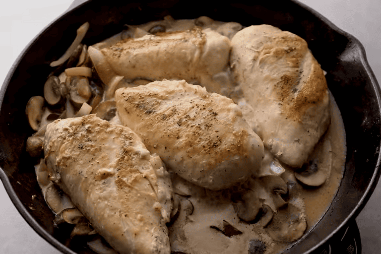 Stuffed chicken marsala recipe in a skillet.