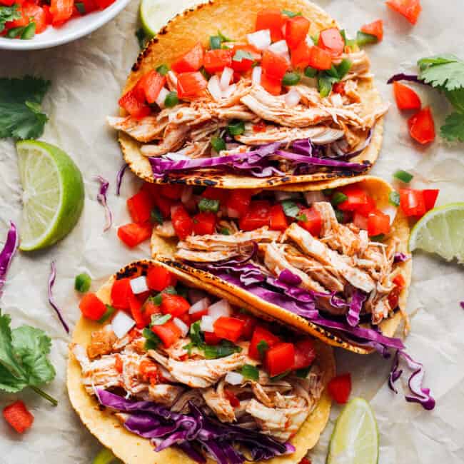 prepared instant pot chicken tacos in a row