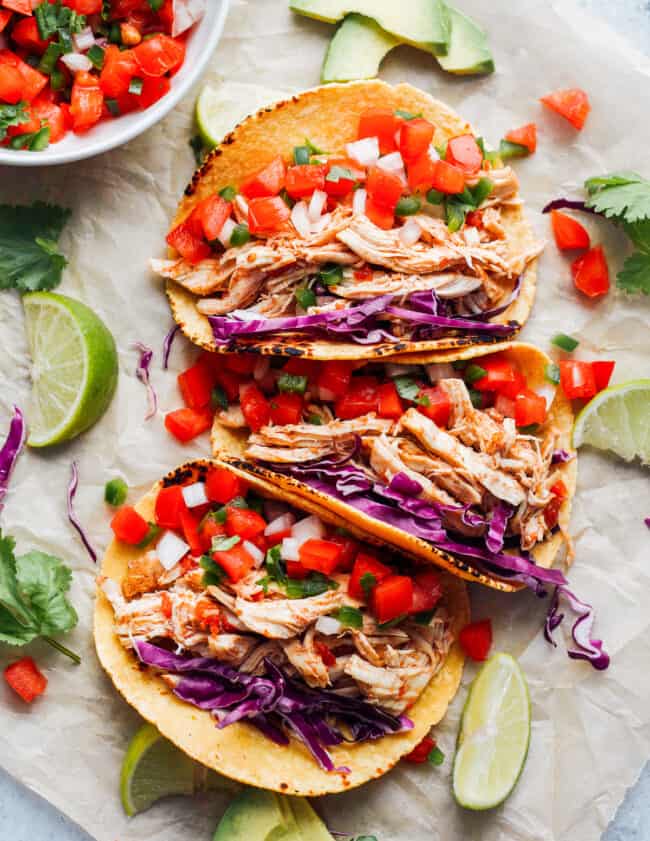 prepared instant pot chicken tacos in a row