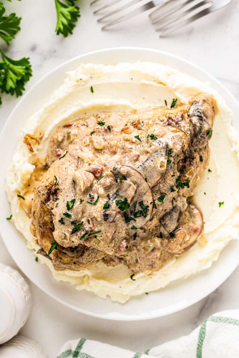 smothered chicken served with mashed potatoes