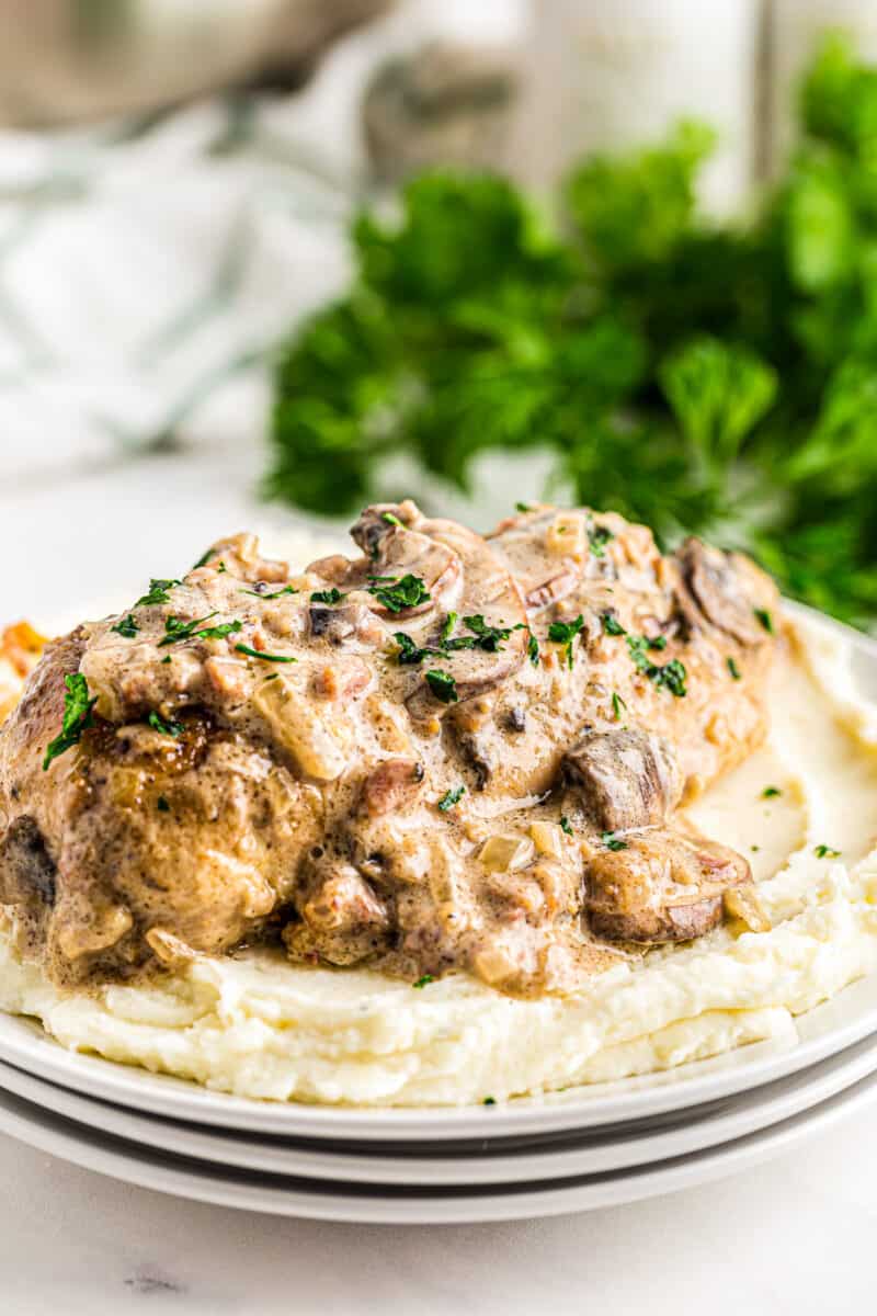 smothered chicken served with mashed potatoes