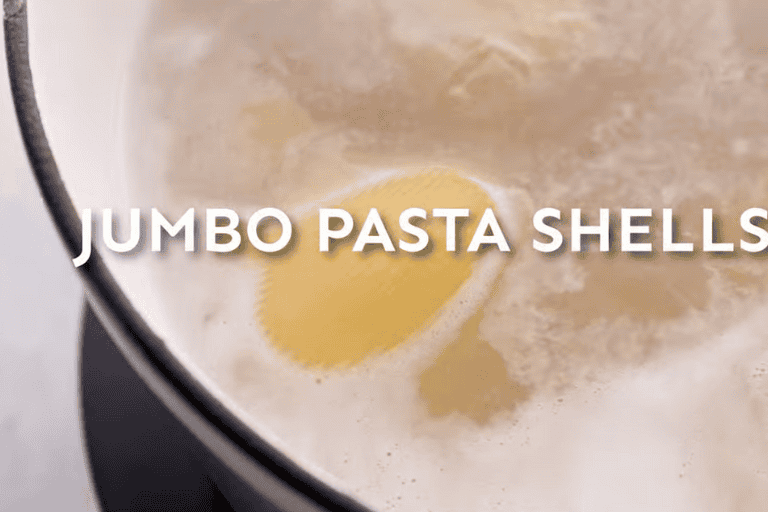 Jumbo pasta shells in boiling water.
