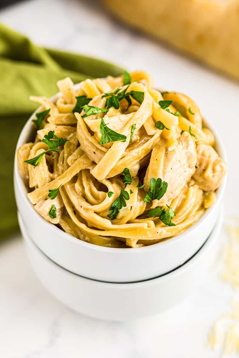 up close white bowl with instant pot chicken alfredo