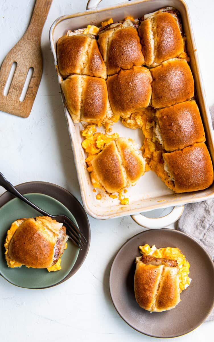 pull apart breakfast sandwiches in baking dish and on plates