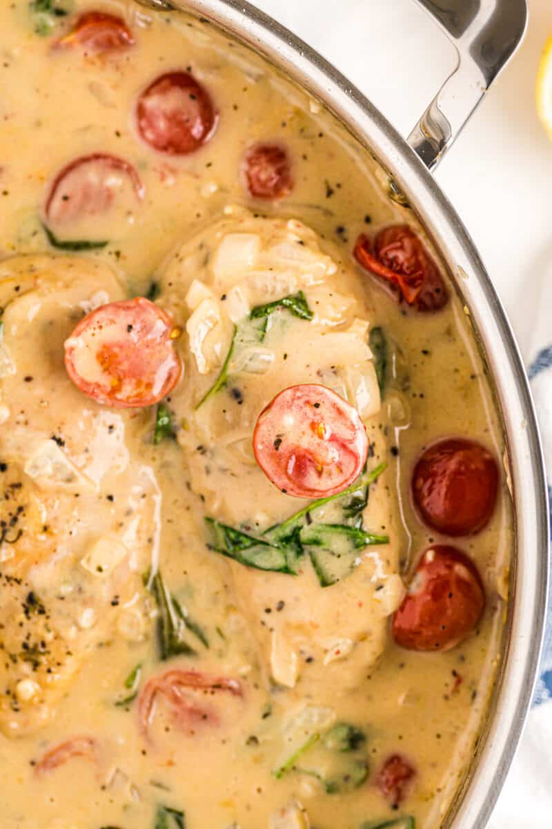 tuscan chicken with cream sauce in skillet