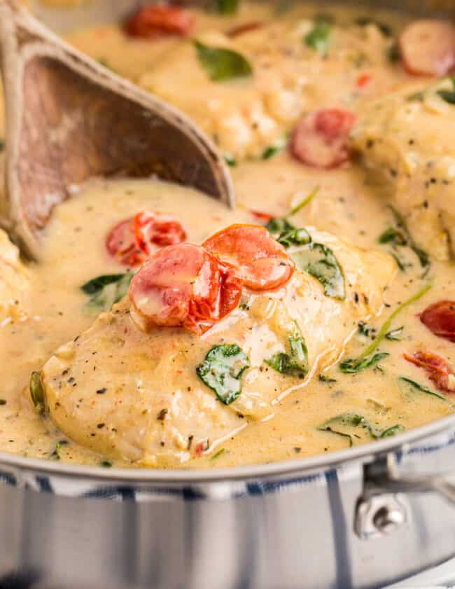 tuscan chicken with cream sauce in skillet