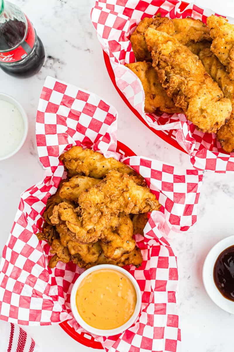 two baskets of fried chicken tenders