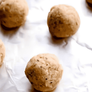 chicken meatballs on a foil-lined baking sheet.