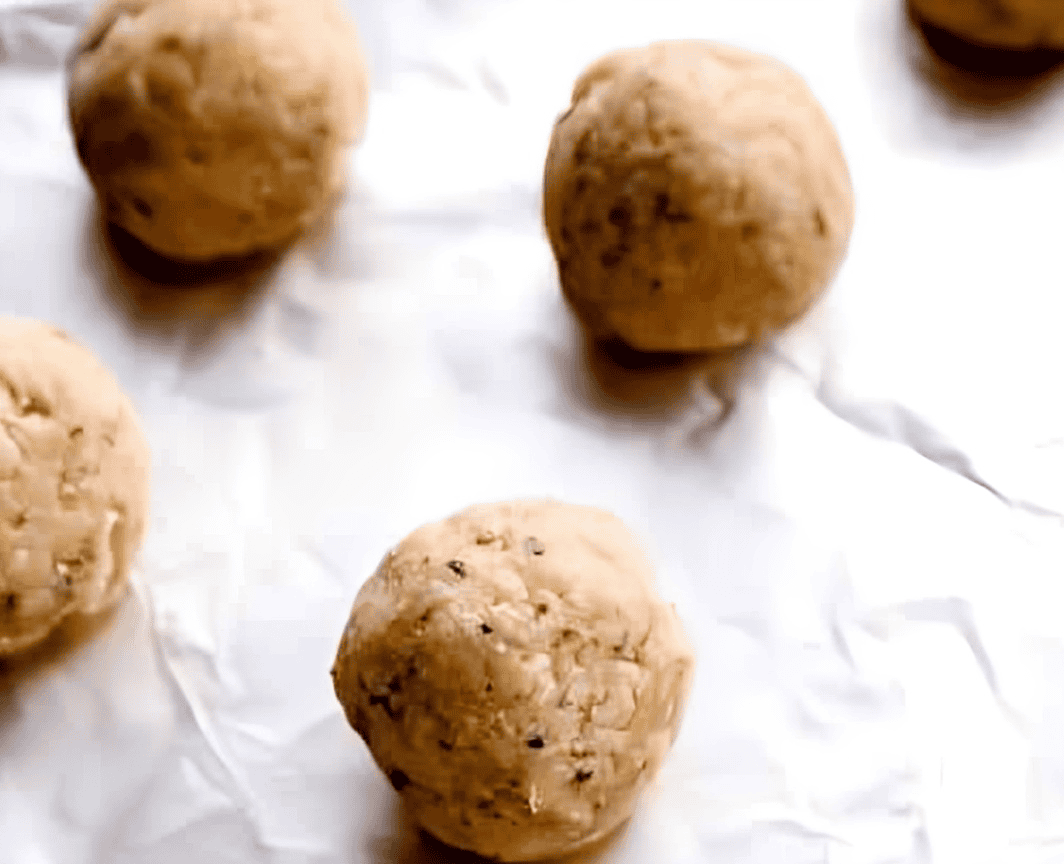 chicken meatballs on a foil-lined baking sheet.