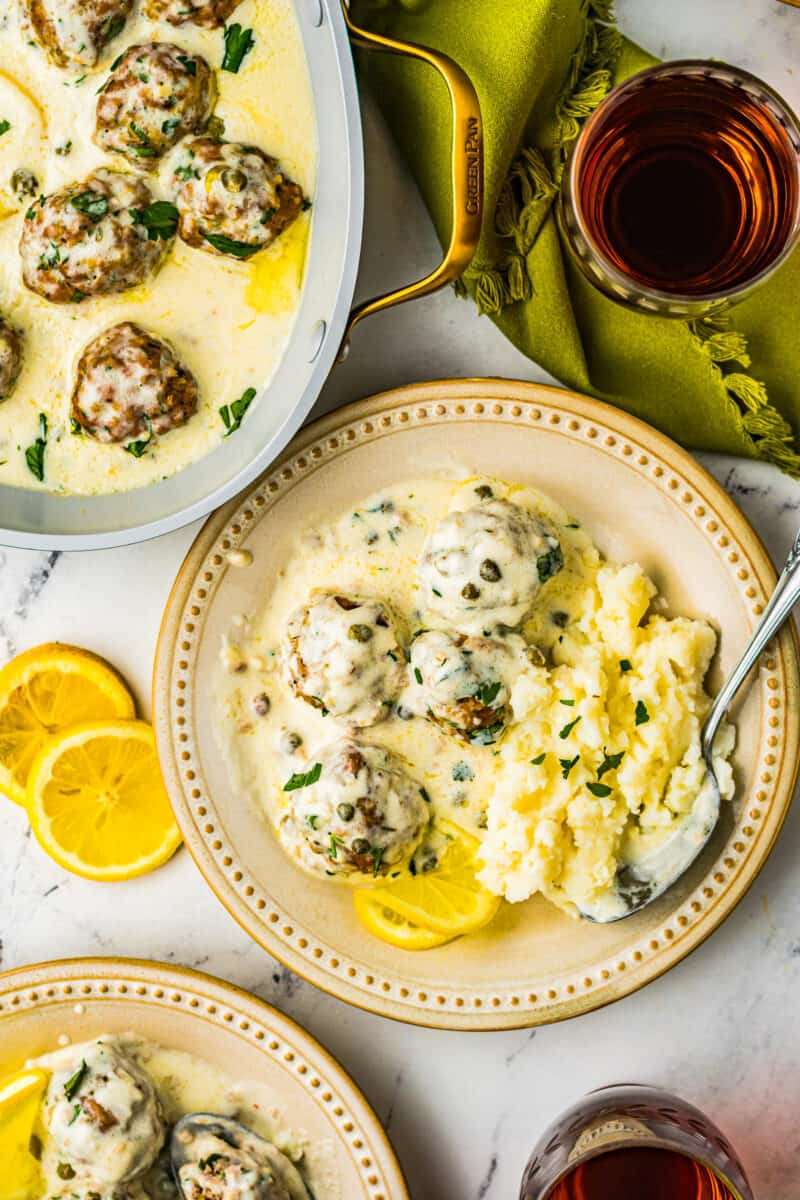 chicken piccata meatballs in sauce over mashed potatoes