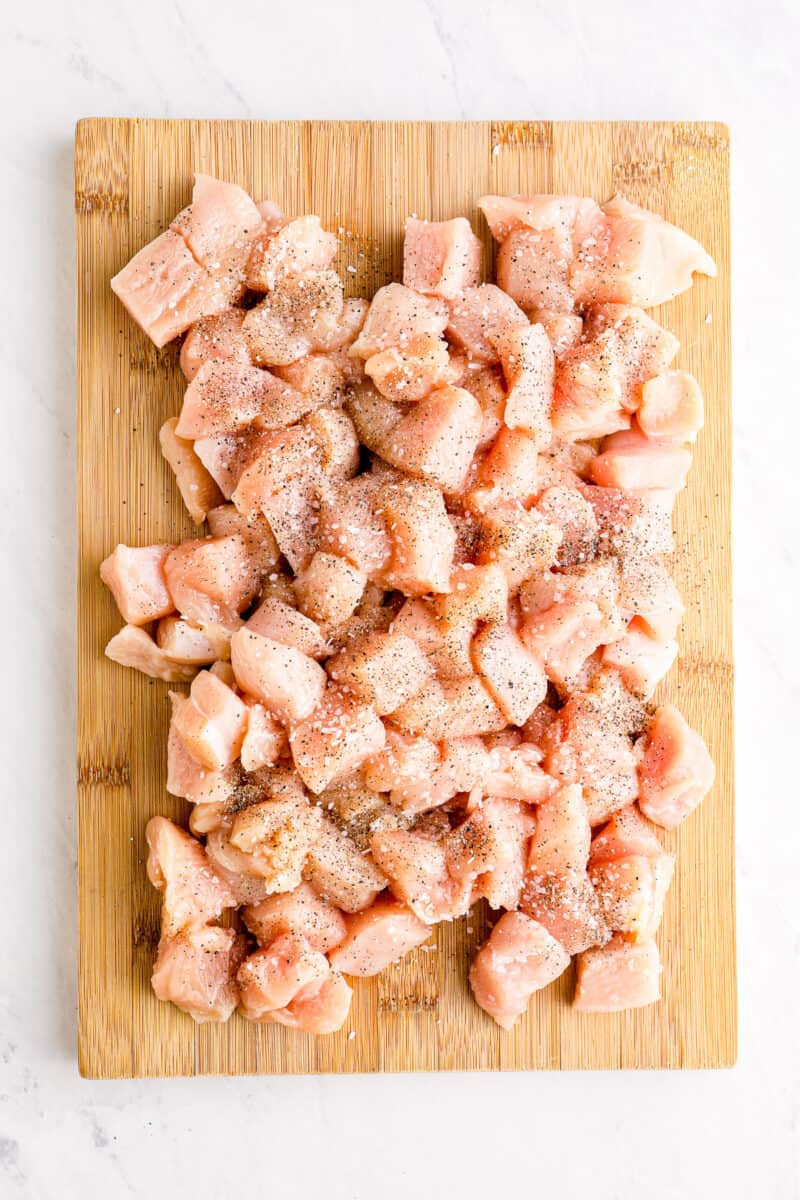 chunks of chicken on cutting board