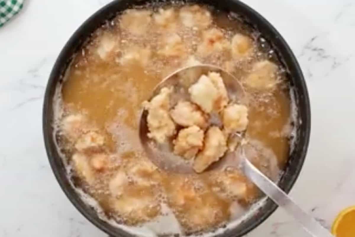removing fried chicken pieces from oil.