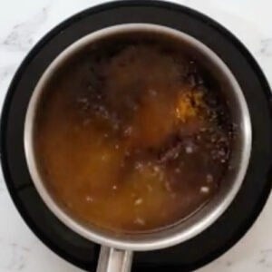 orange sauce ingredients in a saucepan.