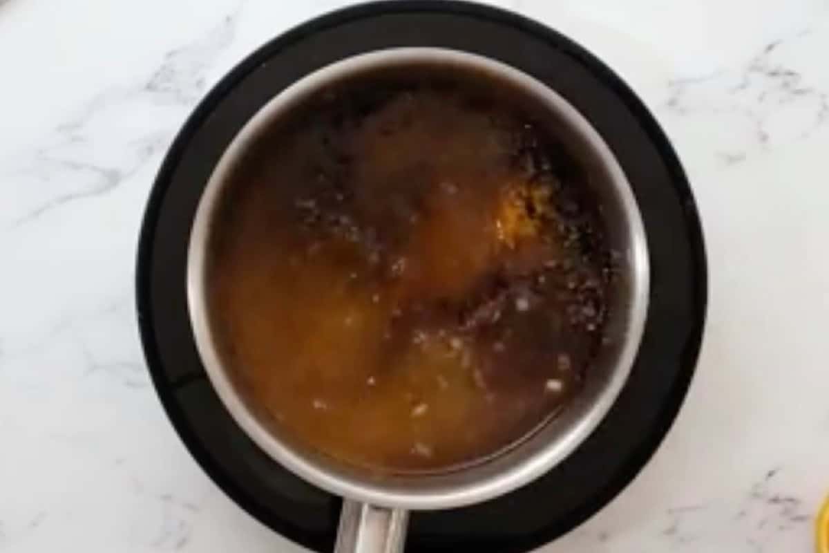 orange sauce ingredients in a saucepan.
