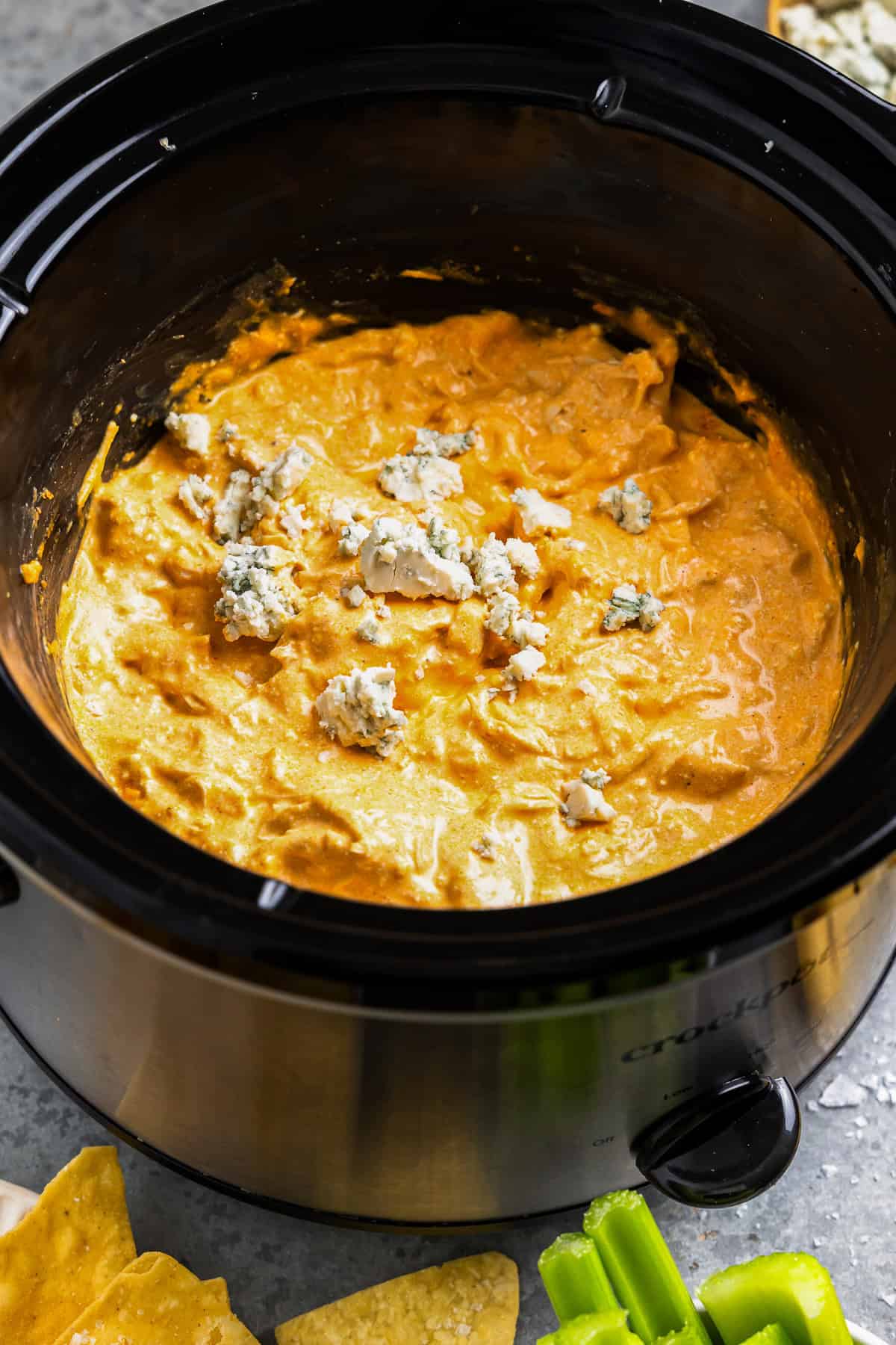 buffalo chicken dip in a crockpot with blue cheese.