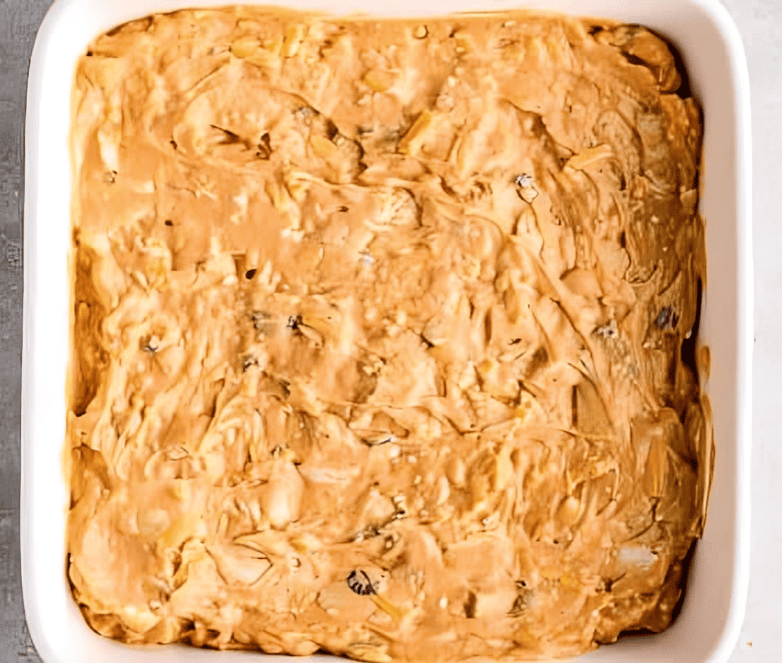 bbq chicken dip in a white baking dish.