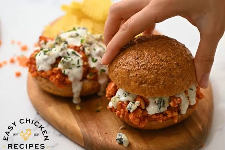 Buffalo chicken sloppy joes topped with ranch dressing, blue cheese crumbles, and chives.